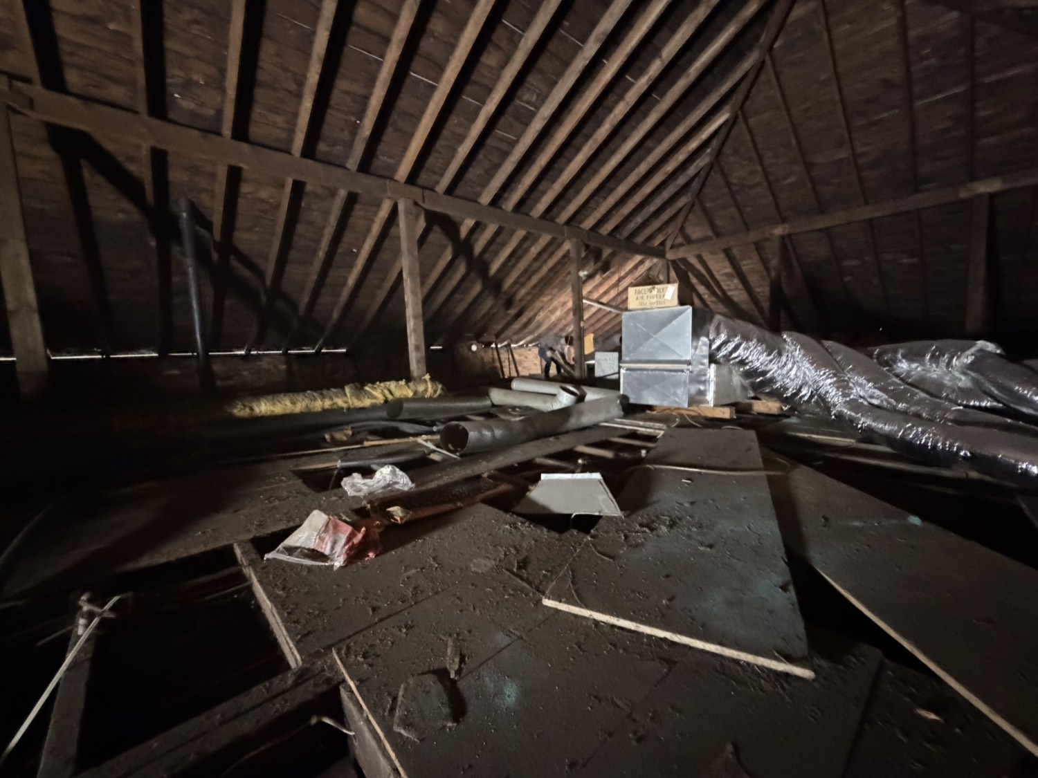 Before - cluttered attic